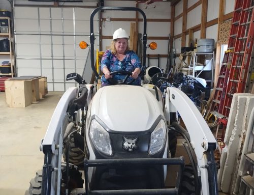 Michele on a Bobcat Tractor